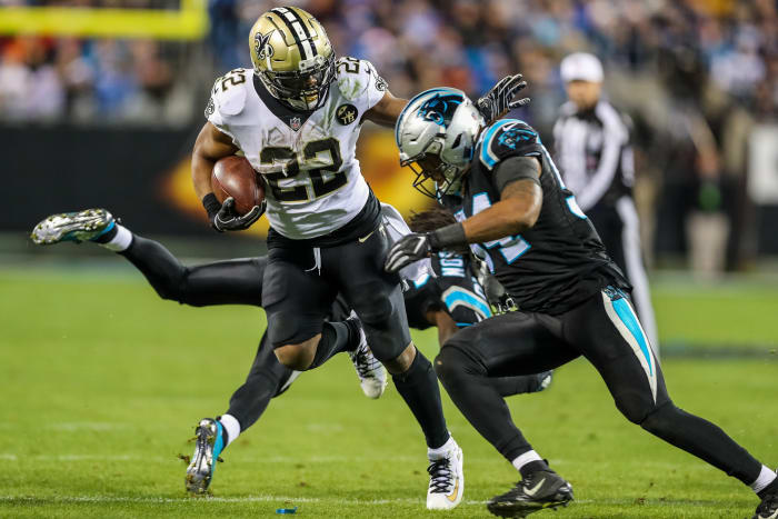 Dec 17, 2018; Carolina Panthers linebacker Shaq Thompson (54) tries to stop New Orleans Saints running back Mark Ingram (22). Mandatory Credit: Jim Dedmon-USA TODAY Sports